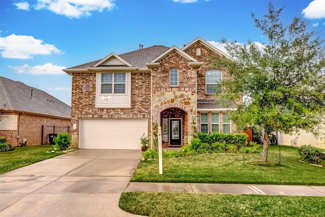 front facade featuring a front yard and a garage