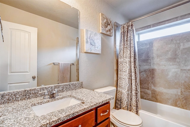 full bathroom with vanity, toilet, and shower / bath combo