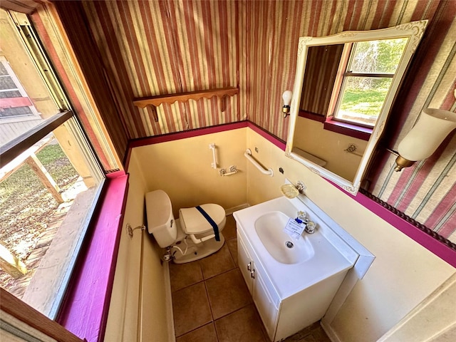 bathroom with tile patterned floors, vanity, and toilet