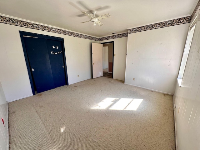 unfurnished bedroom with ceiling fan and light carpet