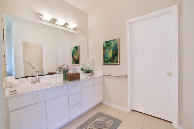 bathroom featuring tile patterned flooring and vanity