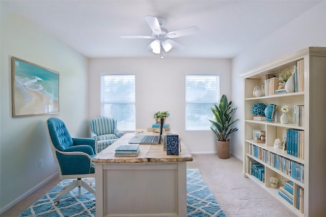 office space with light colored carpet and ceiling fan