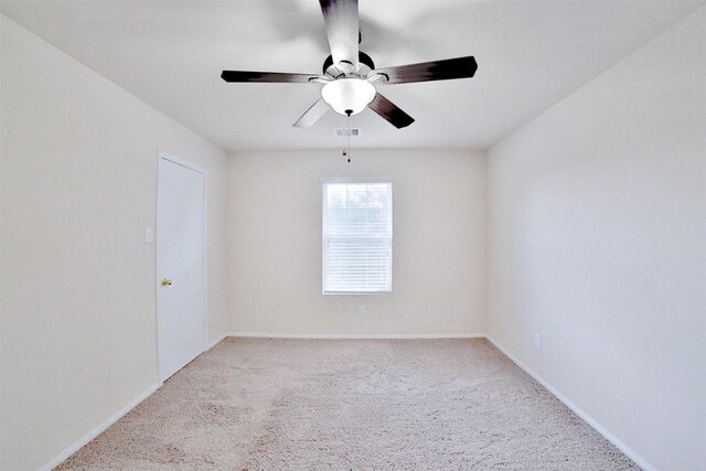 unfurnished room featuring light carpet and ceiling fan