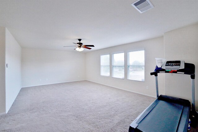 workout room with carpet flooring and ceiling fan