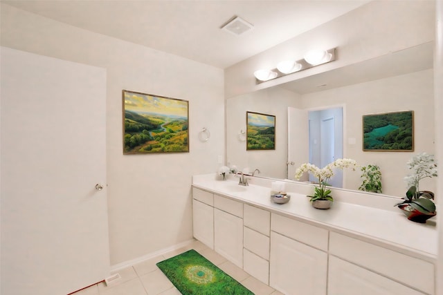 bathroom with tile patterned flooring and vanity