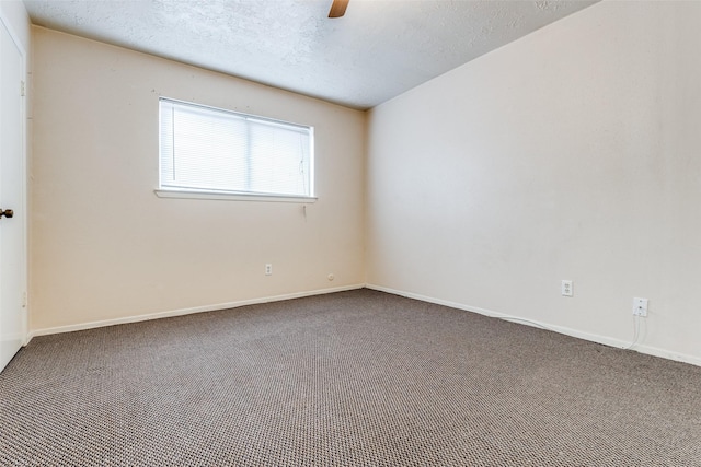 unfurnished room with carpet, a textured ceiling, and ceiling fan