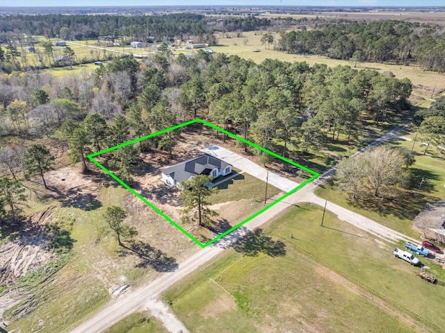 birds eye view of property featuring a rural view