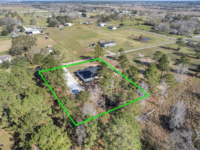 birds eye view of property featuring a rural view