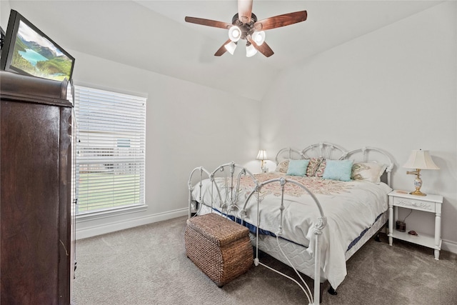 bedroom featuring ceiling fan, carpet floors, and vaulted ceiling