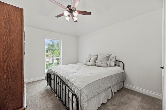 carpeted bedroom with ceiling fan and lofted ceiling