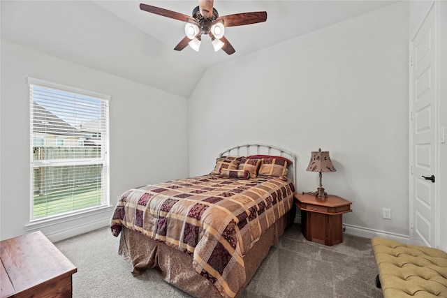 carpeted bedroom with ceiling fan, lofted ceiling, and multiple windows