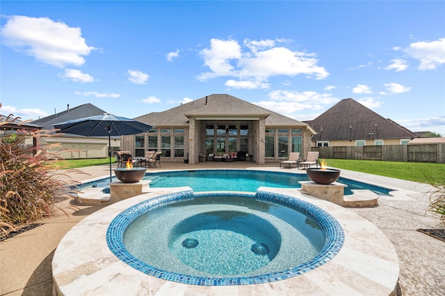 view of swimming pool with a patio area and an in ground hot tub