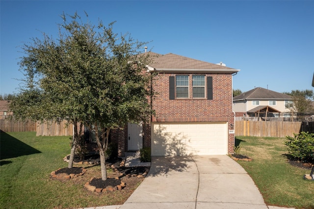 view of front of house featuring a garage and a front yard