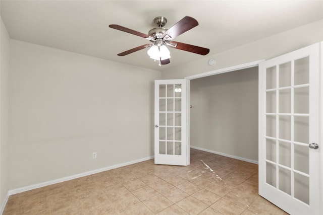 empty room with ceiling fan and french doors