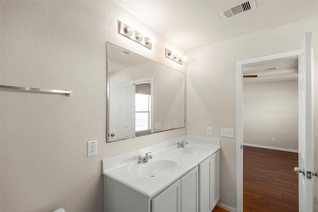 bathroom featuring vanity and hardwood / wood-style flooring