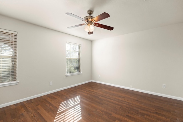 unfurnished room featuring dark hardwood / wood-style floors and ceiling fan