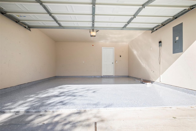 garage featuring electric panel and a garage door opener