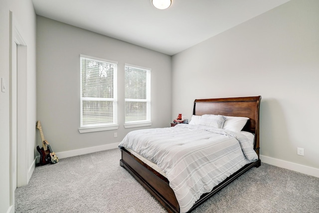 bedroom with light colored carpet