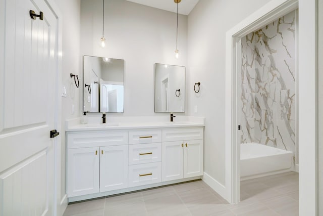 bathroom featuring tile patterned floors, vanity, and shower / washtub combination