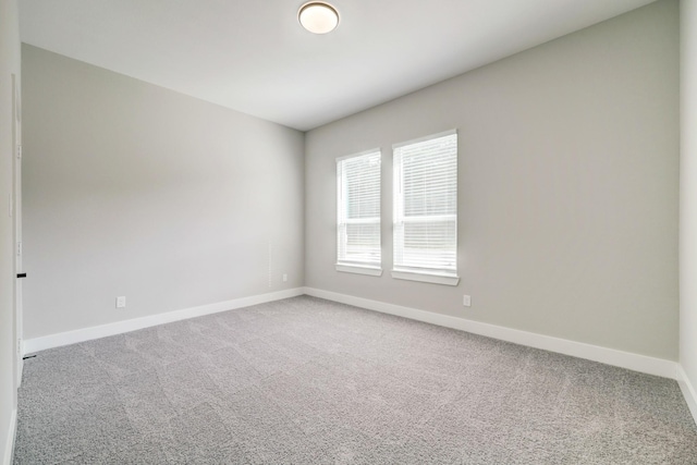 unfurnished room with carpet flooring