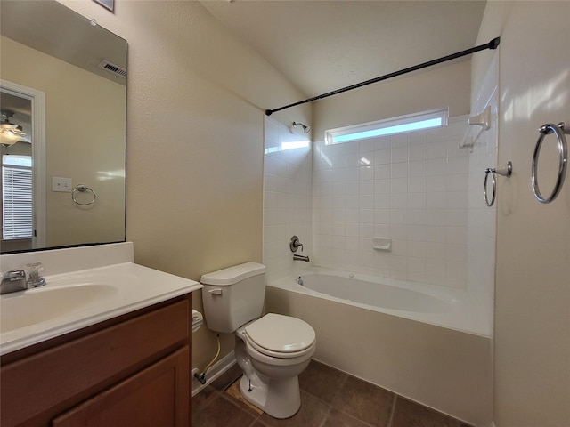 full bathroom with shower / bath combination, a wealth of natural light, vanity, tile patterned flooring, and toilet