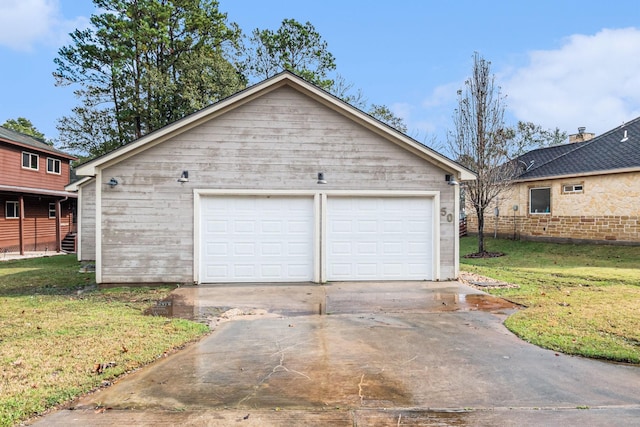 garage featuring a lawn