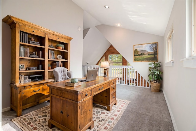 carpeted office space with lofted ceiling