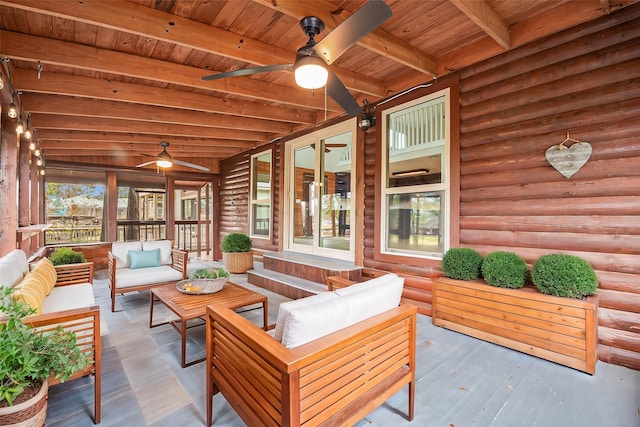 sunroom / solarium with ceiling fan, beam ceiling, and wooden ceiling