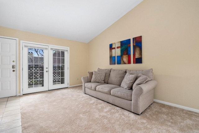 living room featuring tile patterned floors and lofted ceiling