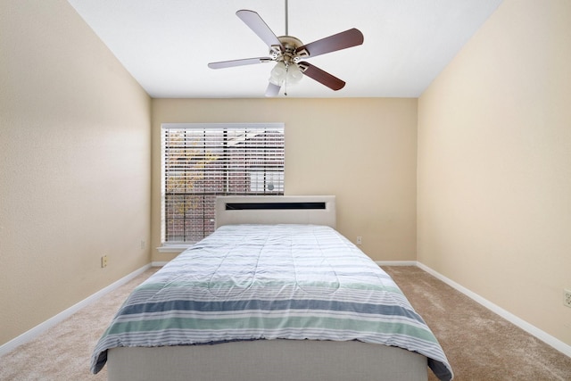 bedroom featuring light carpet and ceiling fan