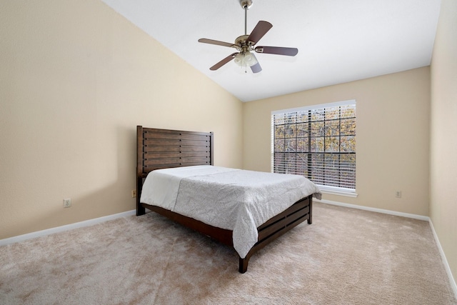 carpeted bedroom featuring vaulted ceiling and ceiling fan