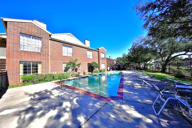 view of swimming pool featuring a patio