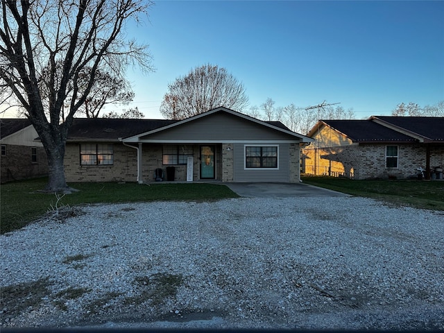 ranch-style home with a front yard