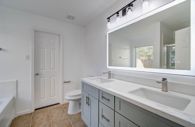 full bathroom featuring tile patterned floors, plus walk in shower, vanity, and toilet