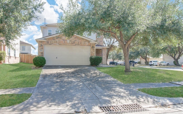 view of front of home featuring a garage and a front yard