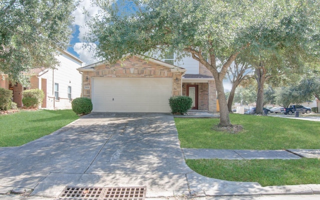 view of front of property with a front yard and a garage