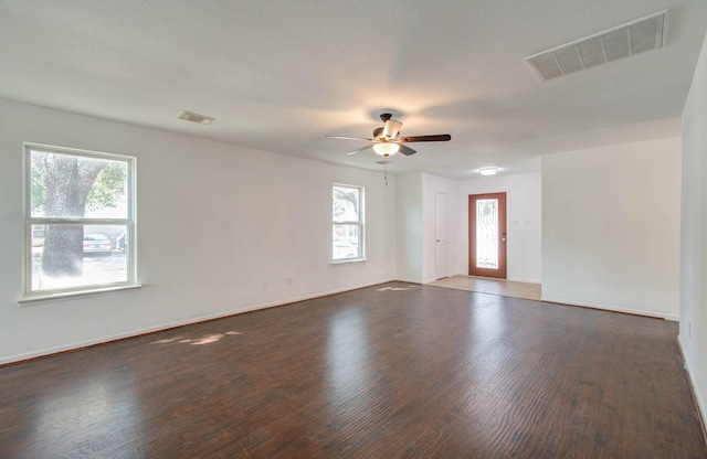 unfurnished room with ceiling fan and dark hardwood / wood-style floors