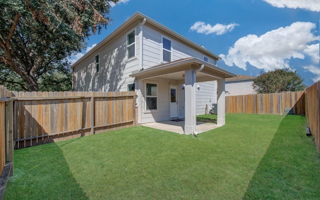 rear view of house featuring a patio, cooling unit, and a lawn