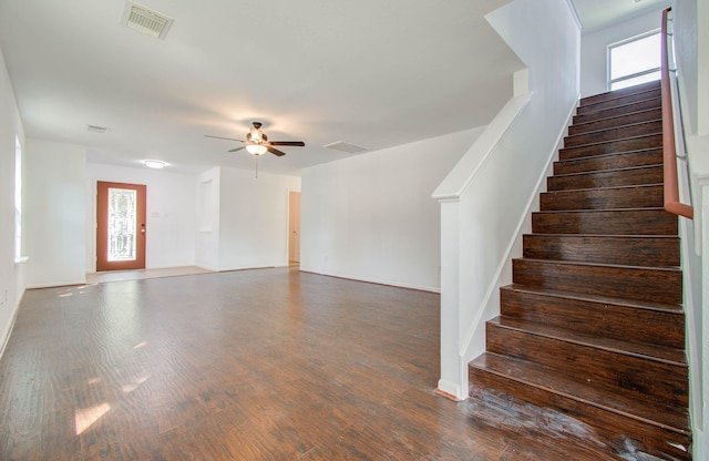 interior space featuring a wealth of natural light, ceiling fan, and wood-type flooring