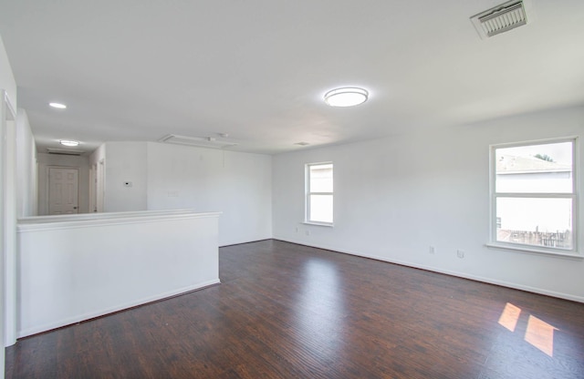 empty room with dark hardwood / wood-style floors