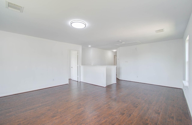 empty room featuring dark wood-type flooring