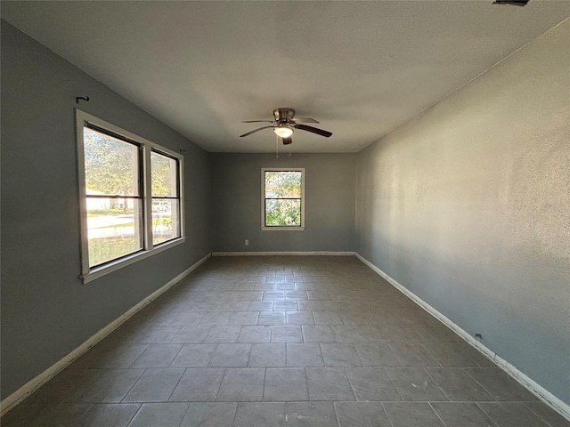 empty room featuring ceiling fan