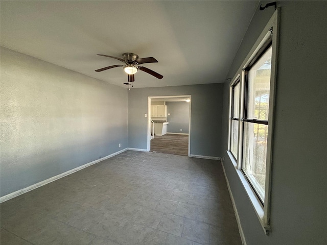 unfurnished bedroom featuring ceiling fan