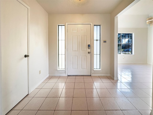 tiled entrance foyer with a wealth of natural light