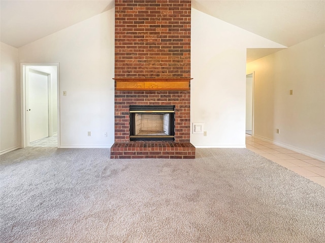 unfurnished living room featuring carpet, a brick fireplace, and lofted ceiling