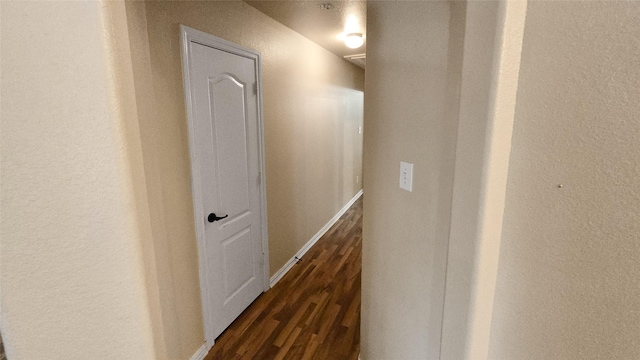 hall featuring dark wood-type flooring