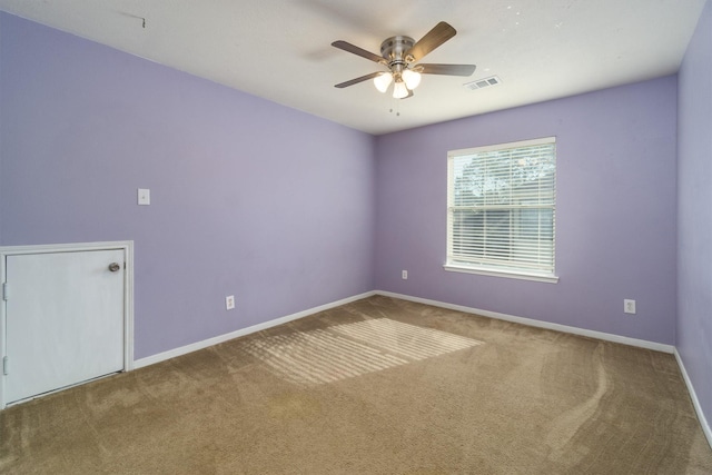 carpeted empty room with ceiling fan