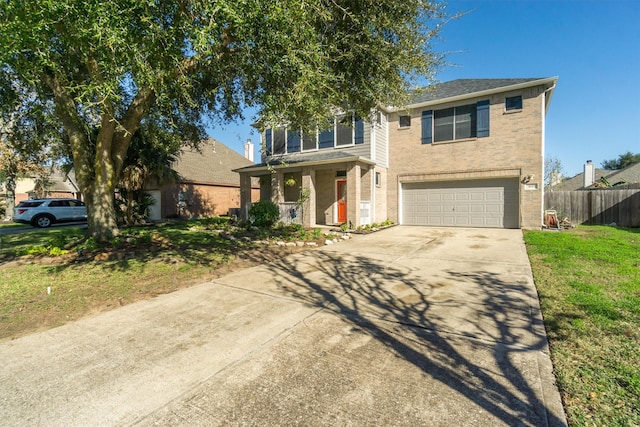 view of front facade featuring a garage and a front lawn