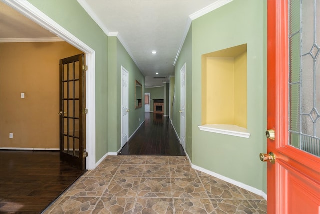 hallway featuring ornamental molding