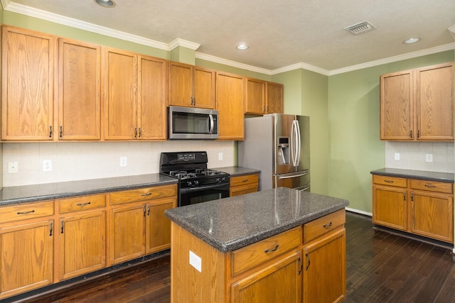 kitchen featuring stainless steel appliances, dark hardwood / wood-style floors, crown molding, decorative backsplash, and a kitchen island